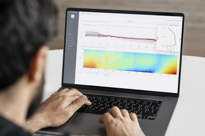 person at computer looking at monitoring data
