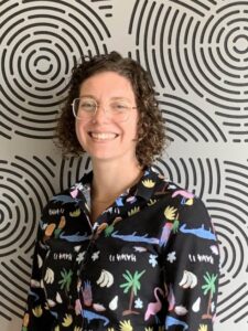 Photo of Jemima in front of patterned background
